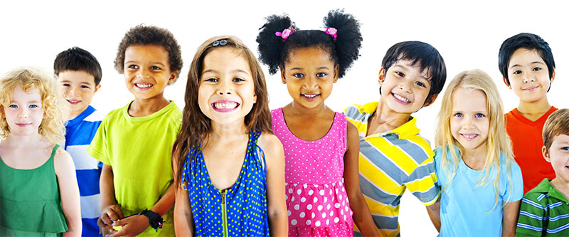 A group of diverse children posing together with smiles, wearing colorful clothing.