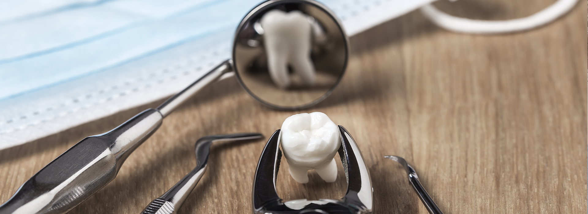 An image featuring a close-up view of a playful scene with a toothbrush and toothpaste on a surface, with a small toy figure seemingly interacting with these items.